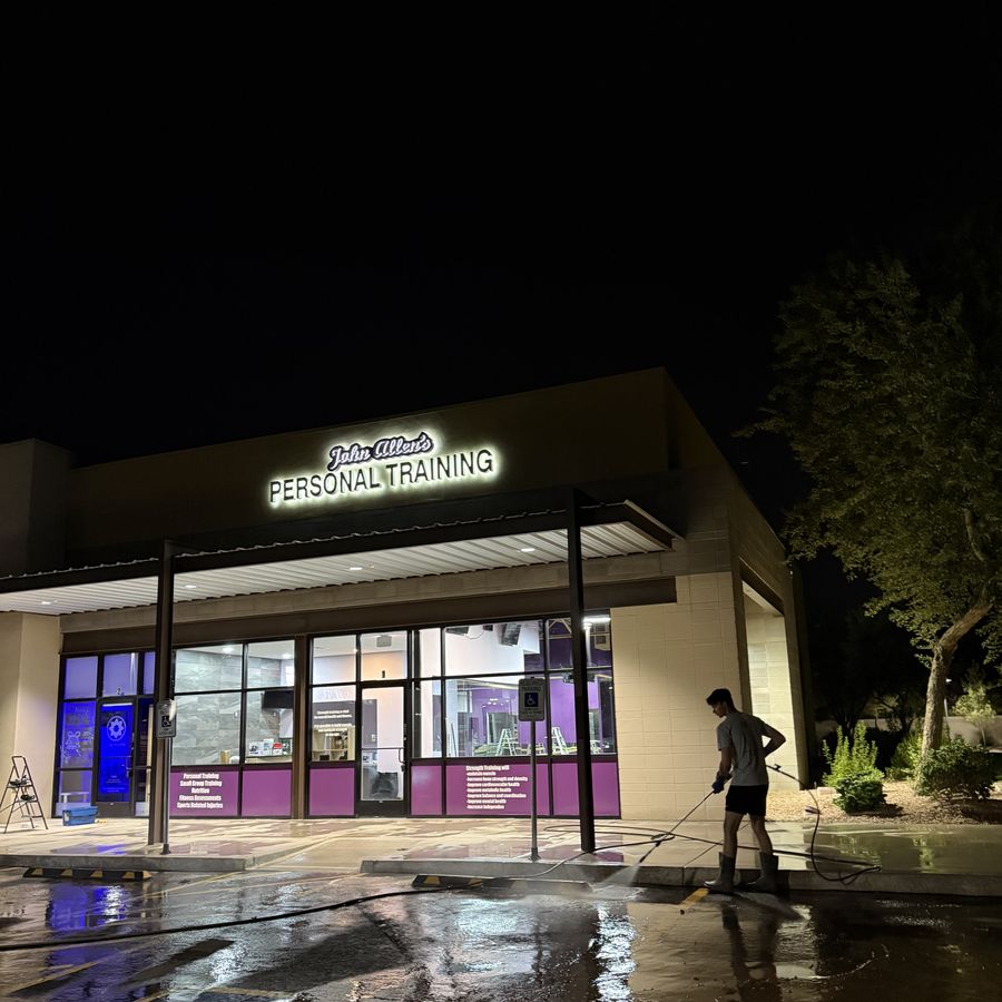 Freshly pressure-washed sidewalk and storefront at John Allen's Personal Training